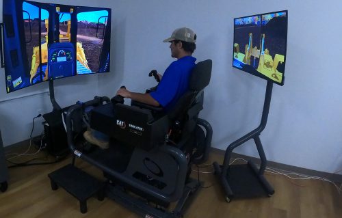 Using authentic Cat controls on the Cat Simulators Dozer system, a TCAT Knoxville student learns how to operate a dozer.